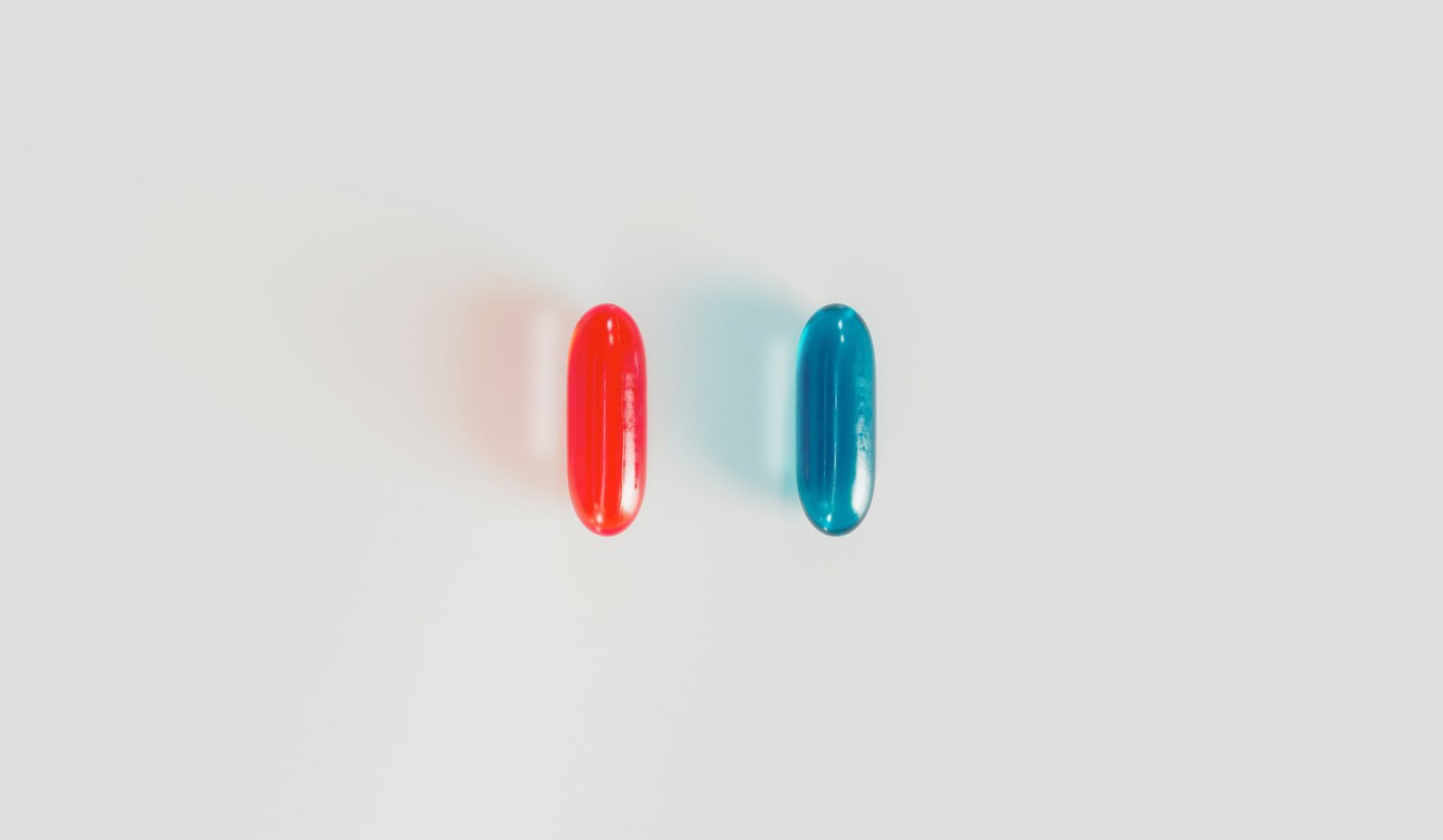 a pair of red and blue surfboards sitting next to each other